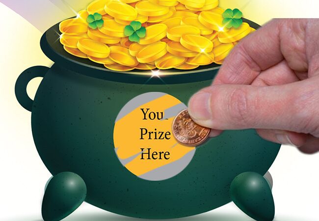 Hand Holding A Coin Scratching Off Prize